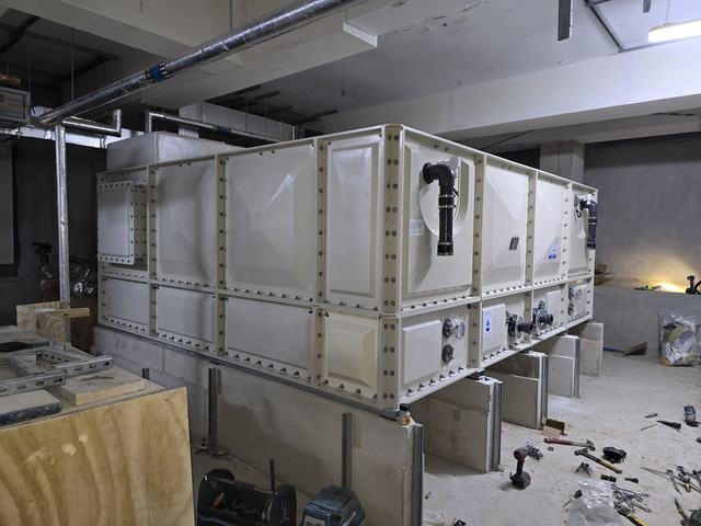 Large tank on concrete plinths